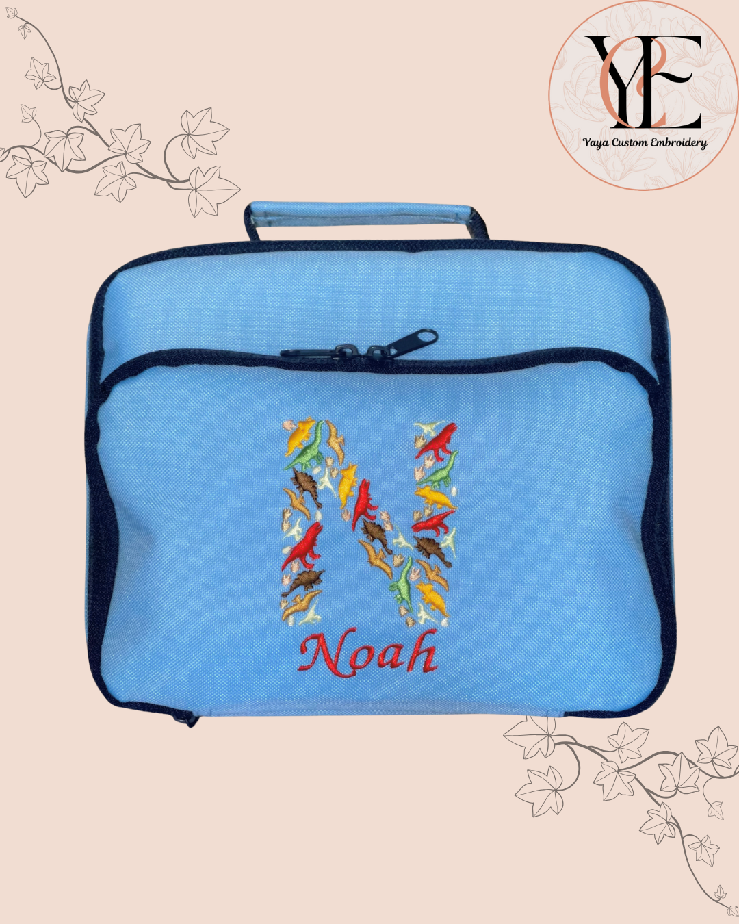 Blue lunch bag with colourful 'Noah' design on a beige background