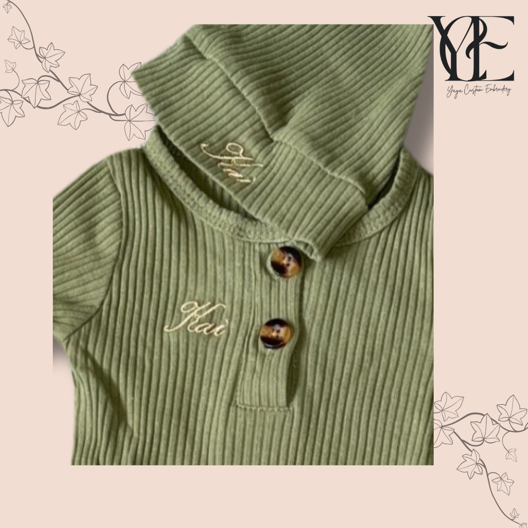 Personalised embroidery in gold of a olive green babygrow and hat. By Yaya Custom Embroidery.