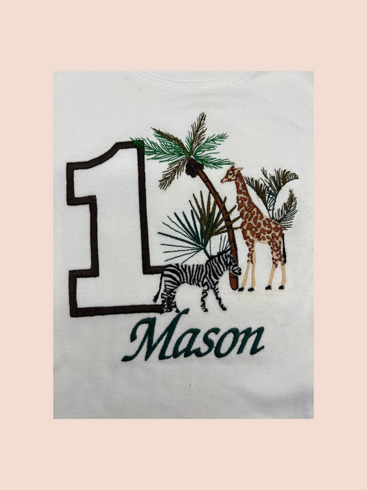 Detailed embroidery of safari birthday themed sweatshirt personalised with name (Mason) and age (1)