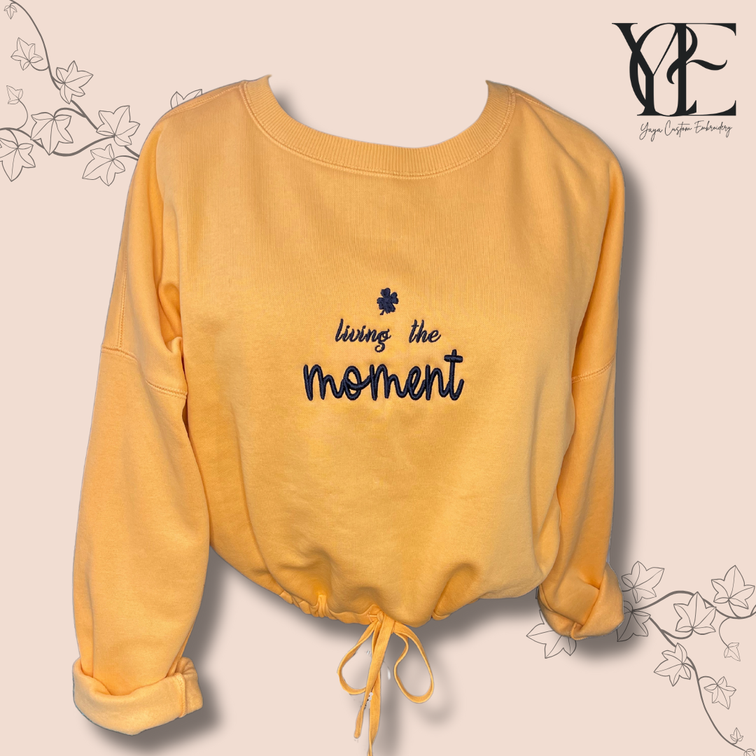 Living the moment embroidery - Apricot crop sweatshirt