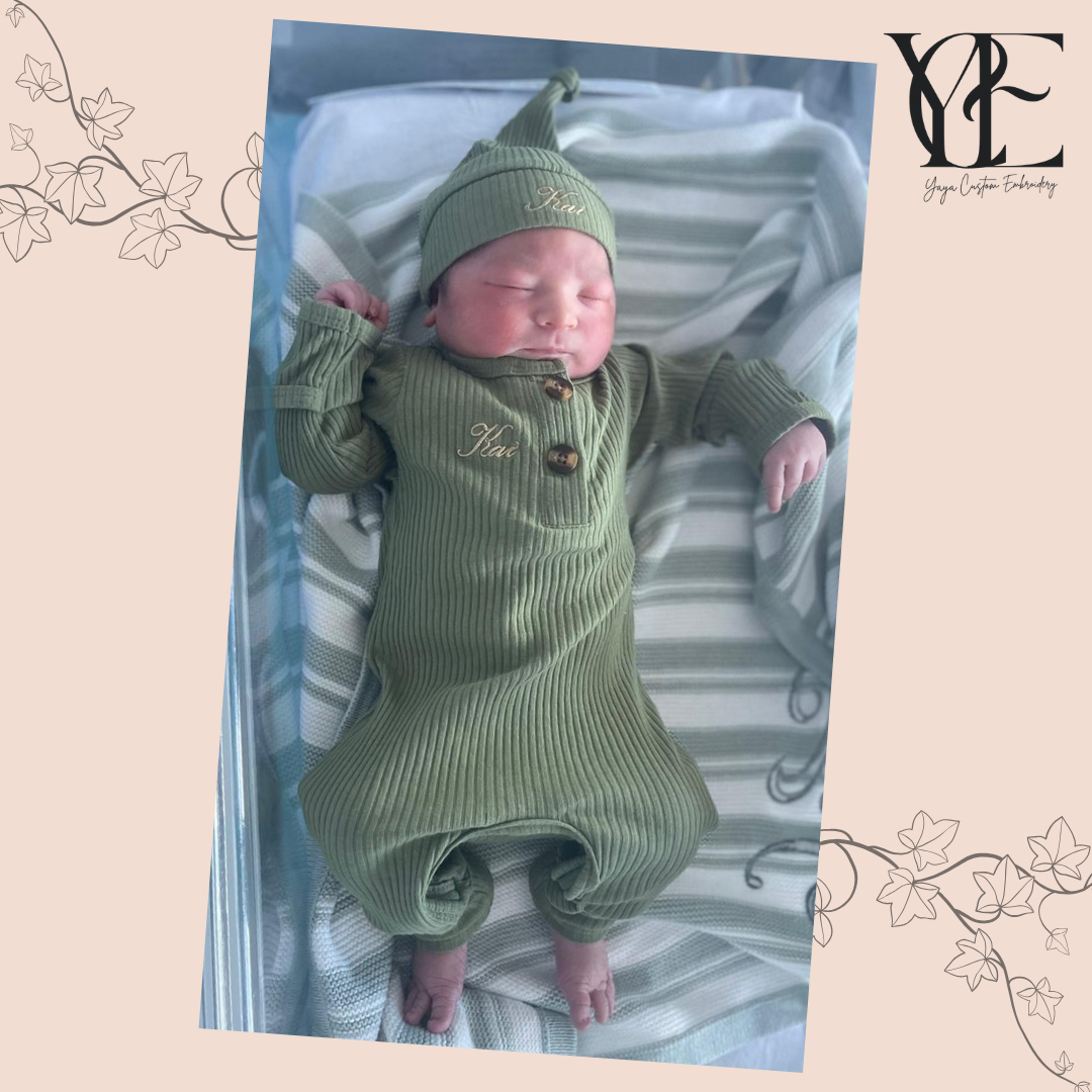 Baby Kai sleeping wearing a personalised babygrow and hat set. By Yaya Custom Embroidery.