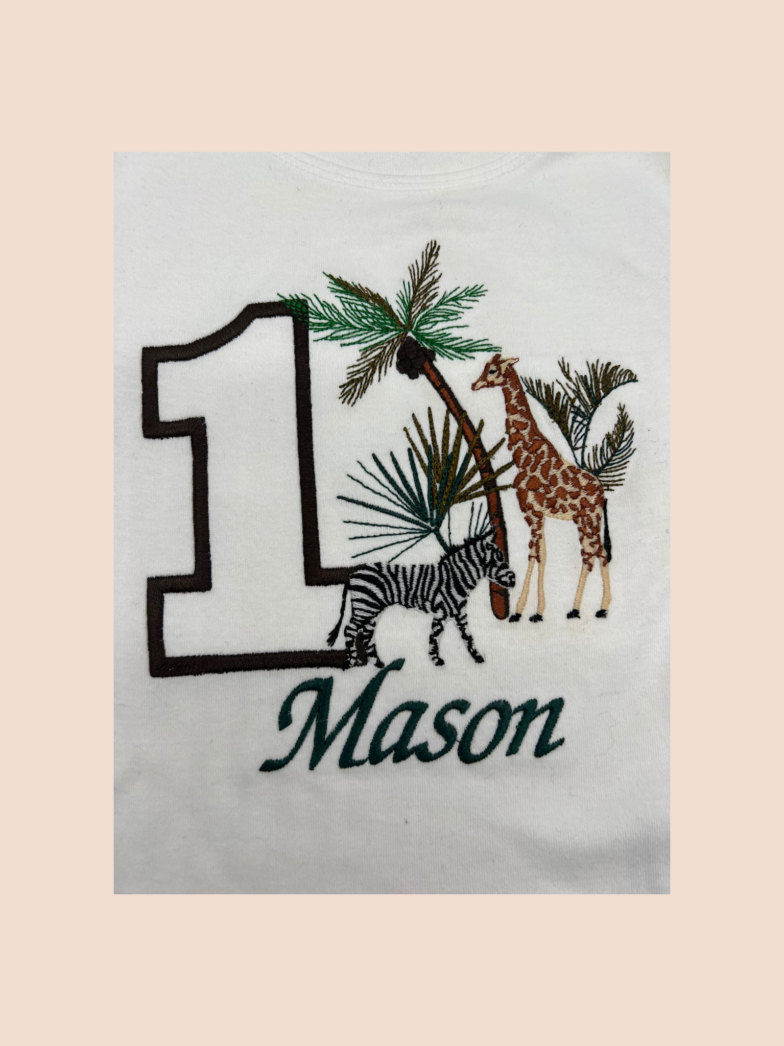 Detailed embroidery of safari birthday themed sweatshirt personalised with name (Mason) and age (1)