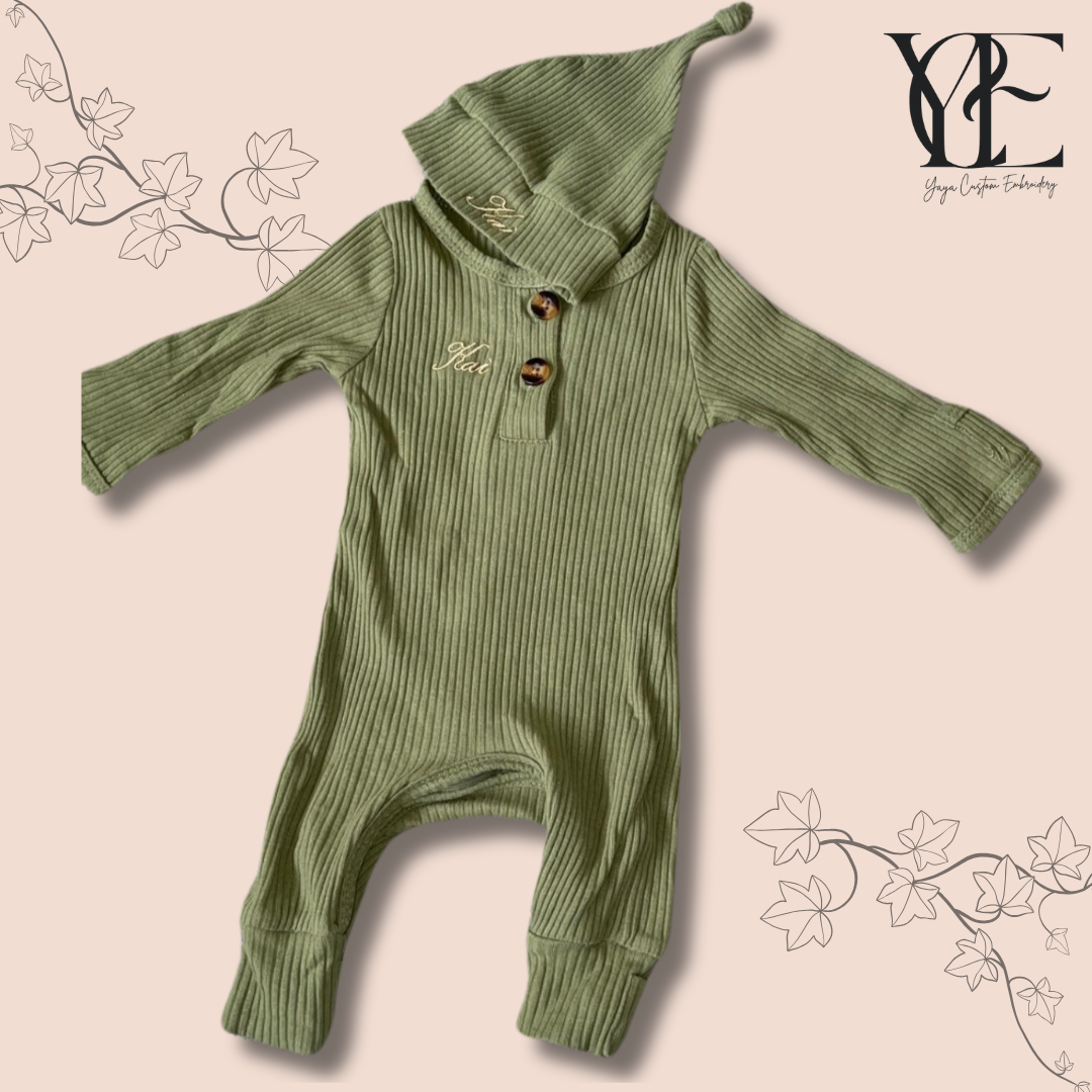 Custom embroidered babygrow and hat set in Olive colour. Embroidered with the baby's name (Kai) over the chest and on the hat. By Yaya Custom Embroidery.