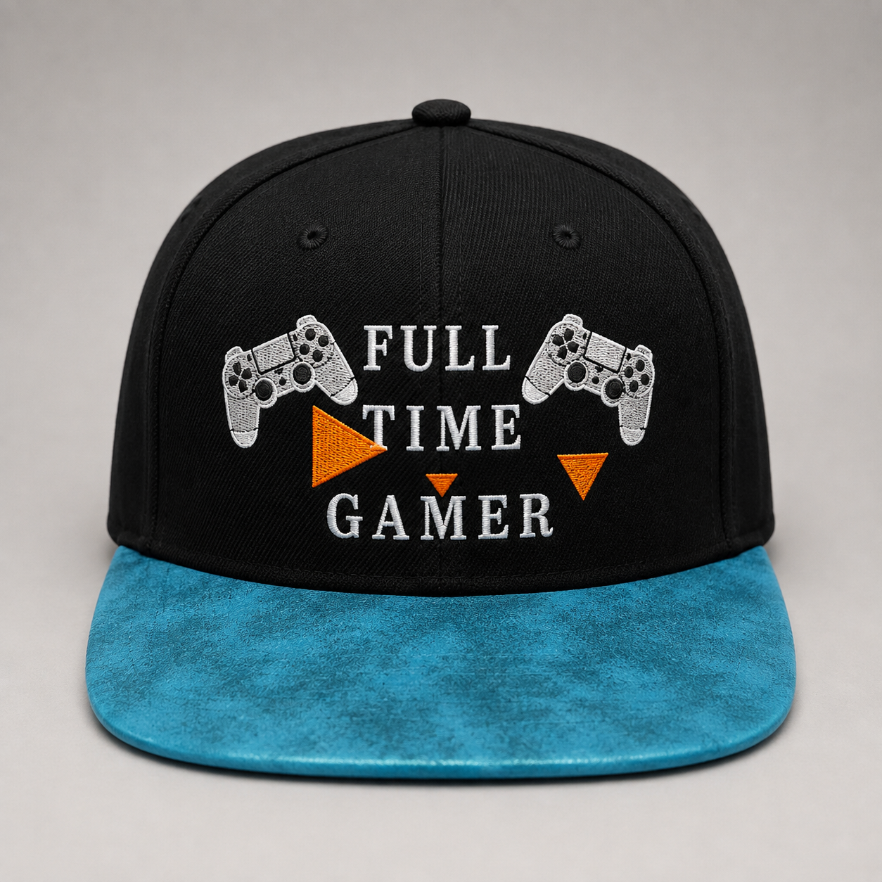 A black snapback cap with a bright blue brim, featuring 'FULL TIME GAMER' embroidered in white text with two white game controllers and orange triangles on the front.