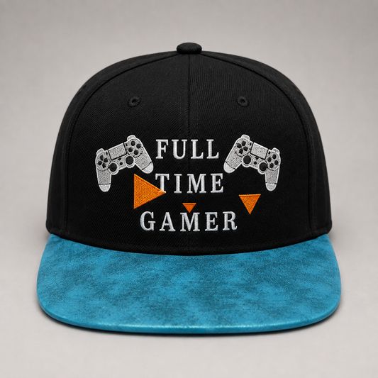 A black snapback cap with a bright blue brim, featuring 'FULL TIME GAMER' embroidered in white text with two white game controllers and orange triangles on the front.