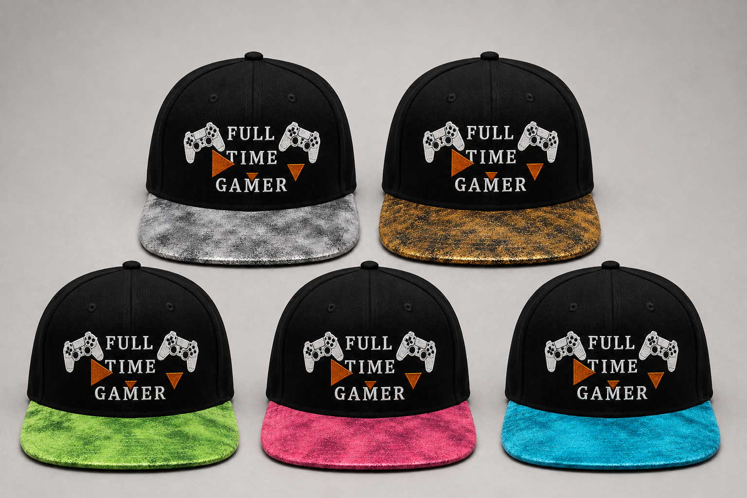 Five black flat-brim snapback caps arranged in a 2x3 grid on a light gray background. Each cap features embroidered white game controllers, the text 'FULL TIME GAMER' in white, and an orange triangle graphic.