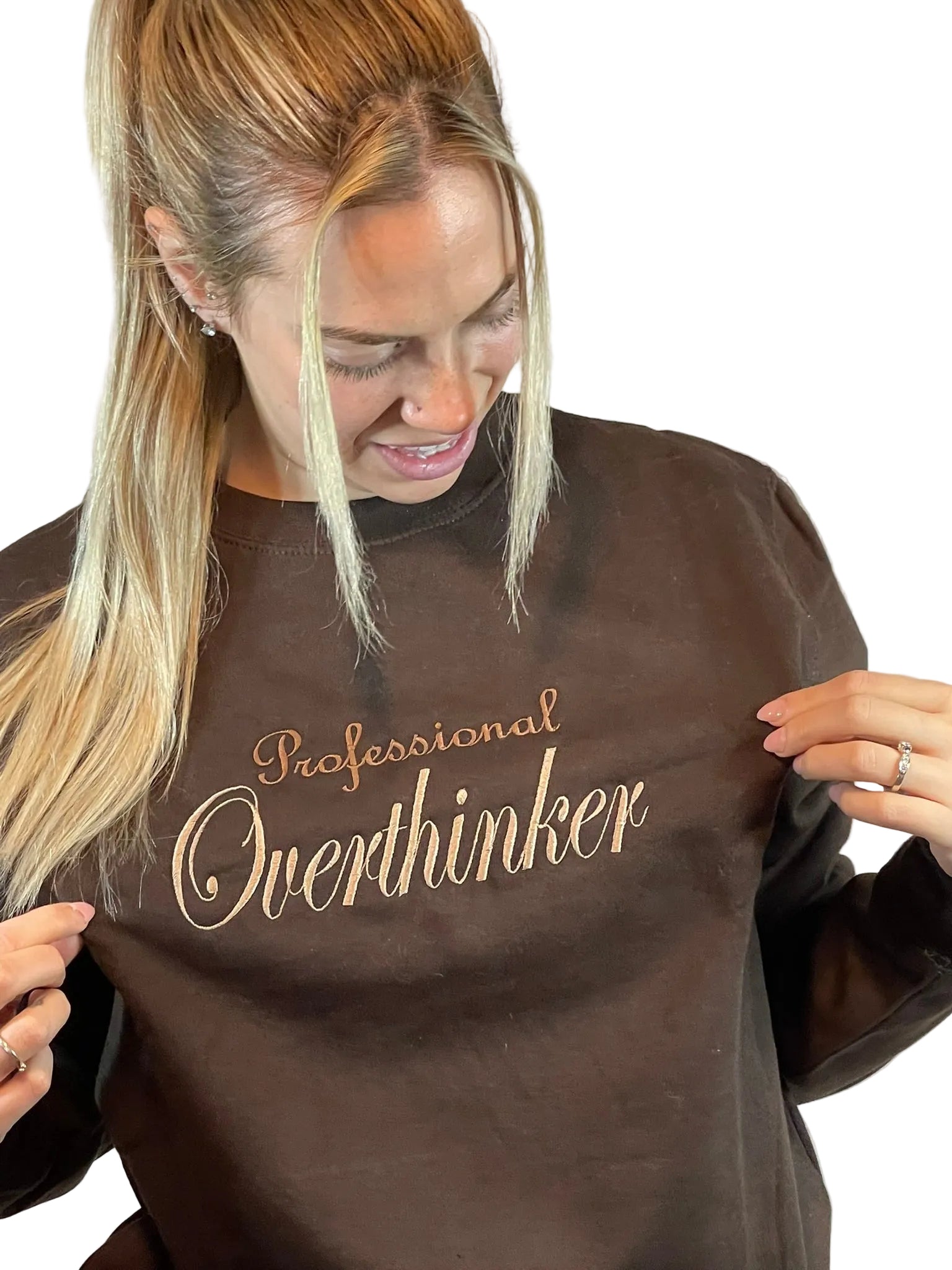 Person wearing a brown sweatshirt with 'Professional Overthinker' text 