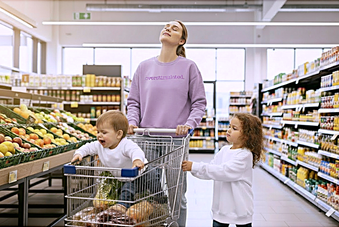 Overstimulated Woman with two children in a grocery store aisle