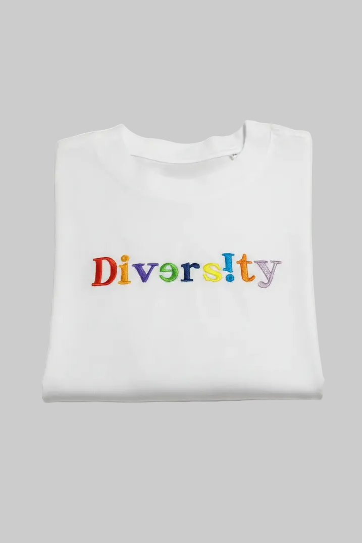 White t-shirt with 'Diversity' in colorful letters on a gray background